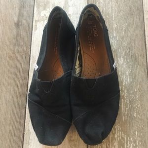Women’s black slip on toms